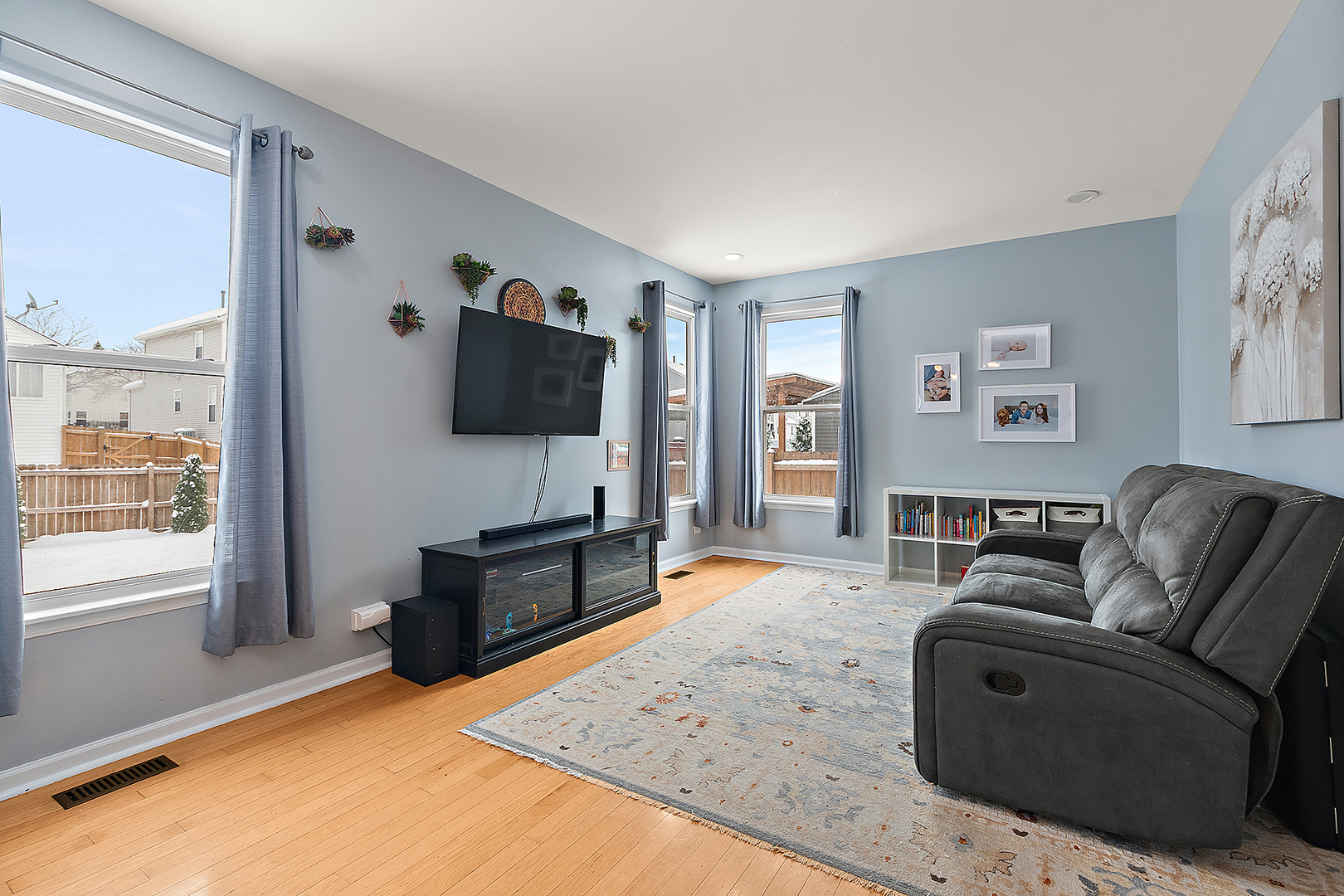 420 Wilshire Lane Bolingbrook, IL 60440 - Photo 13 of 41 a living room with furniture and a flat screen tv