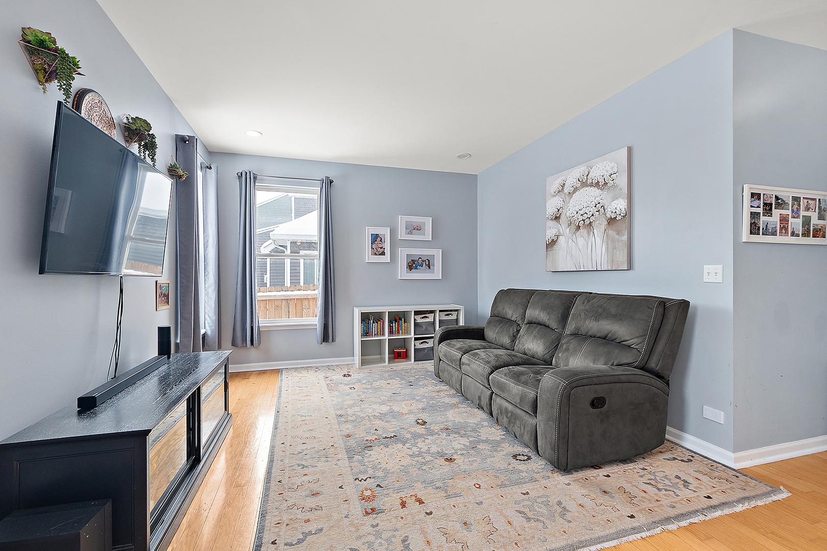 420 Wilshire Lane Bolingbrook, IL 60440 - Photo 15 of 41 a living room with furniture and a flat screen tv