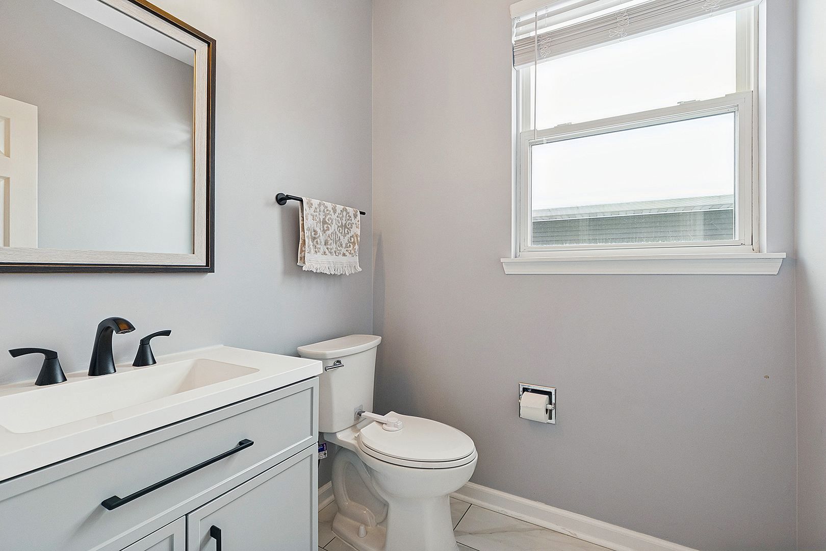 420 Wilshire Lane Bolingbrook, IL 60440 - Photo 16 of 41 a bathroom with a toilet sink and window