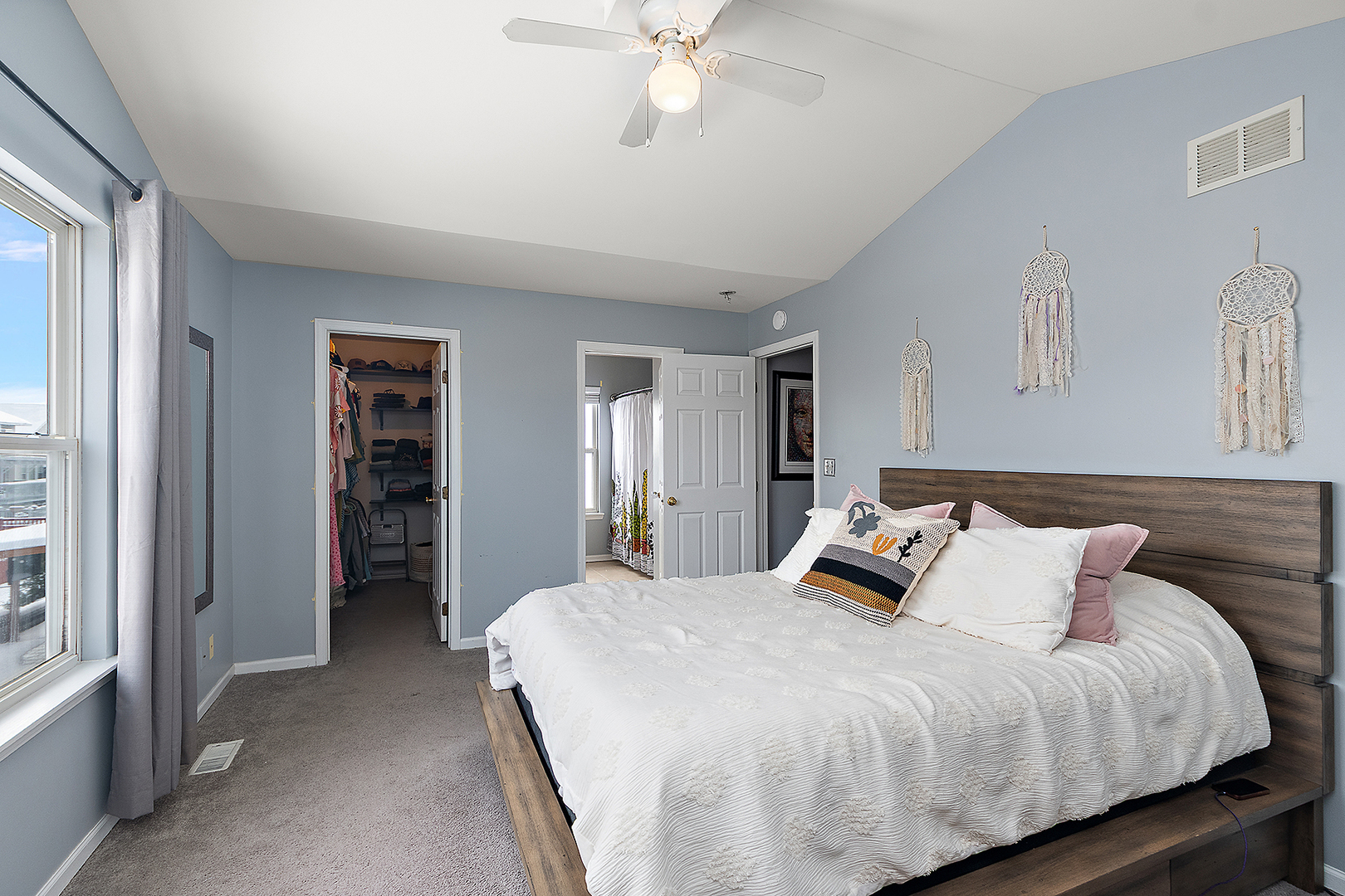 420 Wilshire Lane Bolingbrook, IL 60440 - Photo 18 of 41 a bedroom with a bed and a chandelier