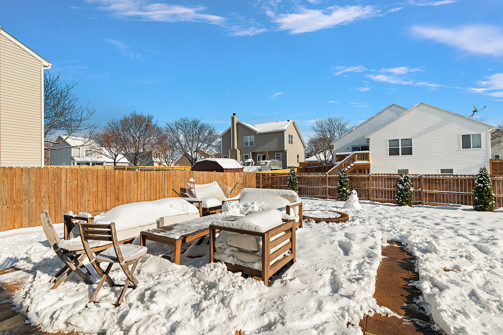 420 Wilshire Lane Bolingbrook, IL 60440 - Photo 29 of 41 a view of a terrace with chairs and wooden fence