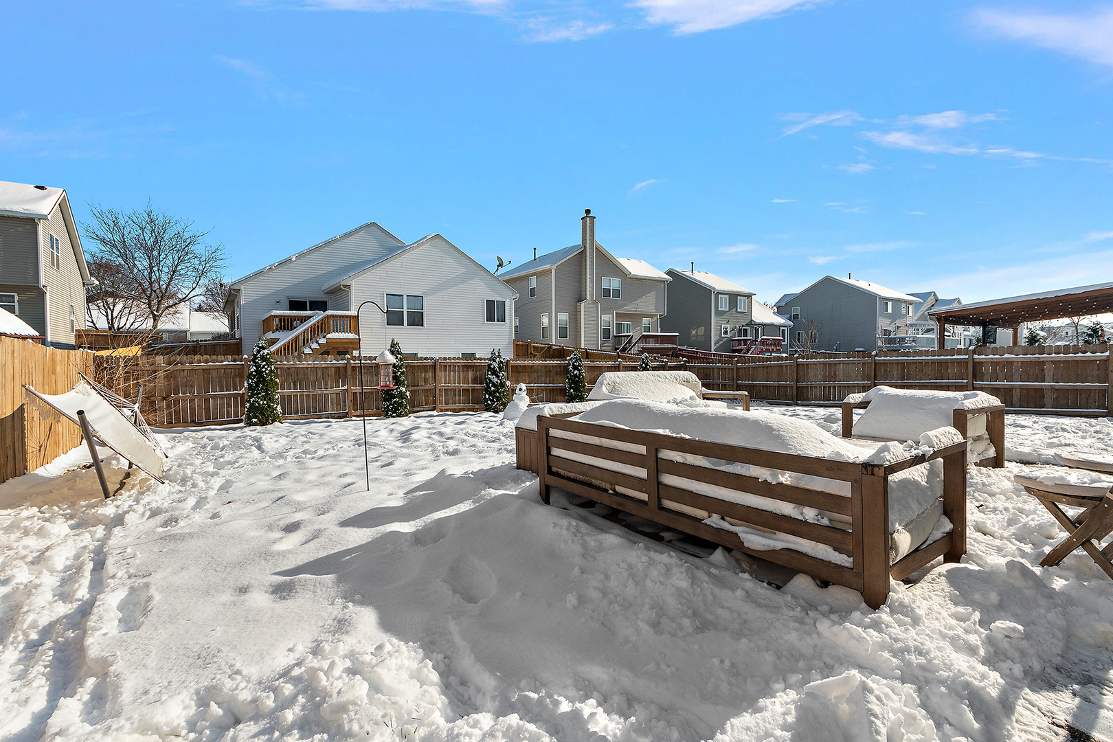 420 Wilshire Lane Bolingbrook, IL 60440 - Photo 31 of 41 a view of a house with a yard covered in snow