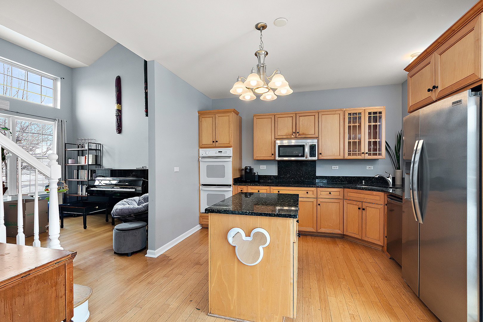 420 Wilshire Lane Bolingbrook, IL 60440 - Photo 7 of 41 a kitchen with stainless steel appliances granite countertop a refrigerator a oven a sink a stove and a dining table with wooden floor