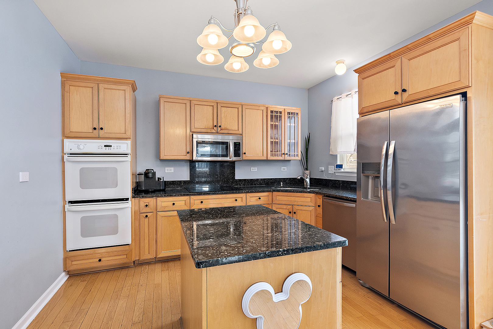 420 Wilshire Lane Bolingbrook, IL 60440 - Photo 9 of 41 a kitchen with stainless steel appliances granite countertop a refrigerator a sink dishwasher a stove with wooden cabinets and floor