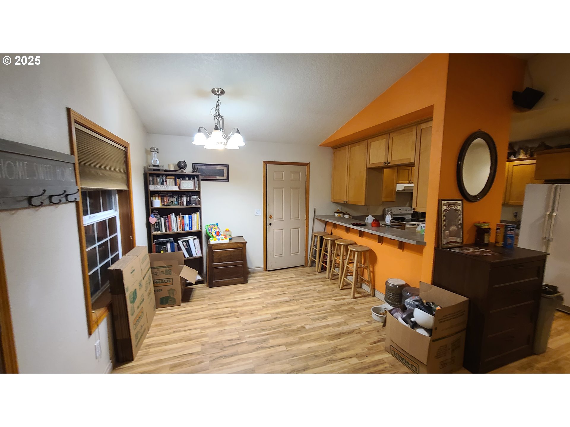 504 Wall Street Silverton, OR 97381 - Photo 5 of 12 a living room with furniture and a flat screen tv
