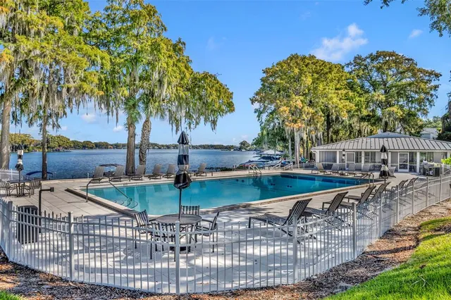 a view of a swimming pool with a patio