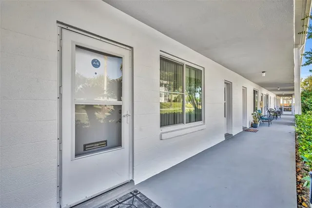 a view of an entryway with kitchen