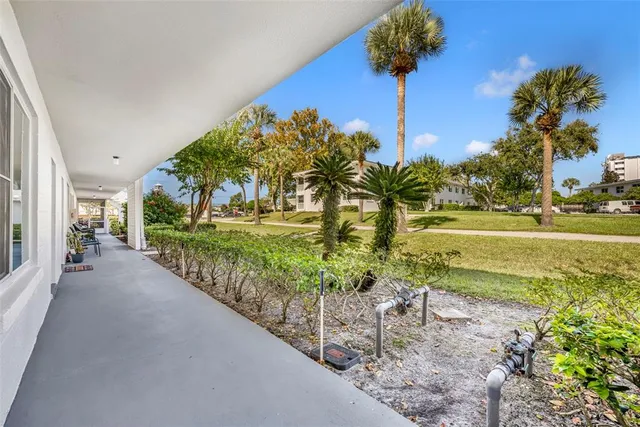 a view of a garden with a house