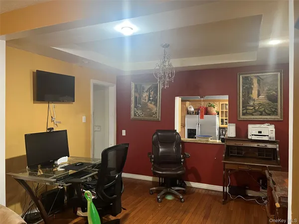 a workspace with furniture and wooden floor