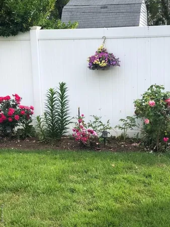 a house with a yard and a potted plant