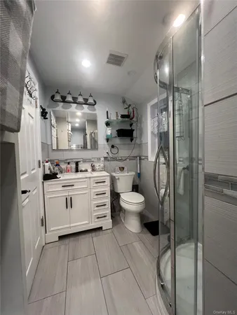 a kitchen with a refrigerator a sink and cabinets