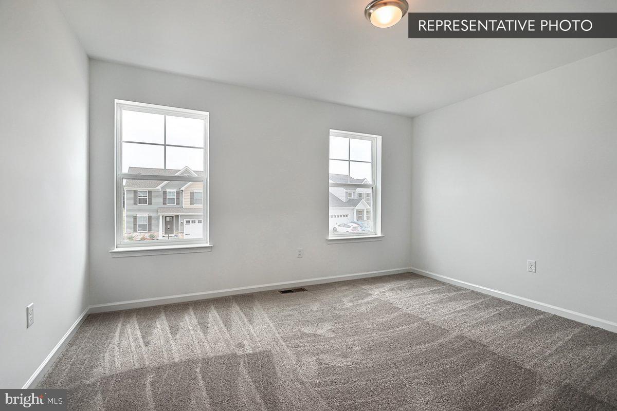 Emily Plan At Hills Spring Grove, PA 17362 - Photo 26 of 26 an empty room with windows