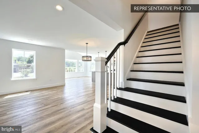 a view of entryway with wooden floor