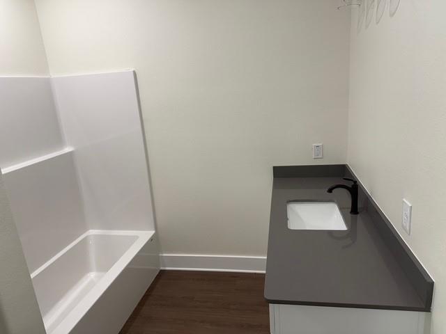 313 Garland Street Bells, TX 75414 - Photo 13 of 15 a bathroom with a bathtub