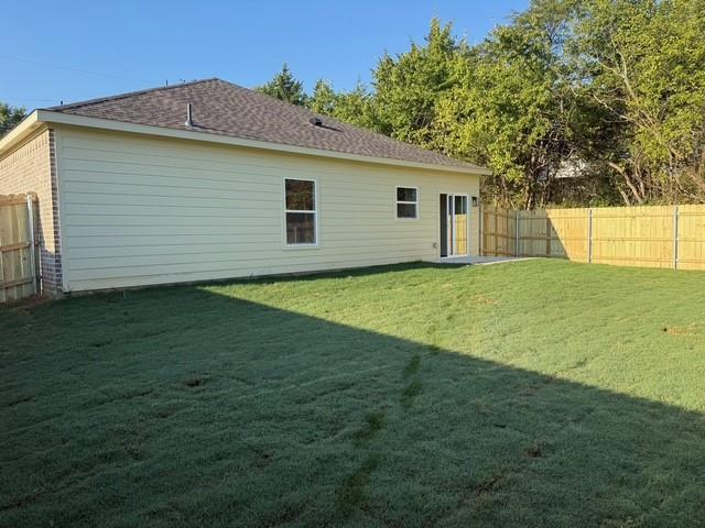 313 Garland Street Bells, TX 75414 - Photo 3 of 15 a view of a backyard with a garden