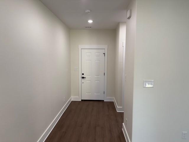 313 Garland Street Bells, TX 75414 - Photo 4 of 15 a view of a hallway with wooden floor