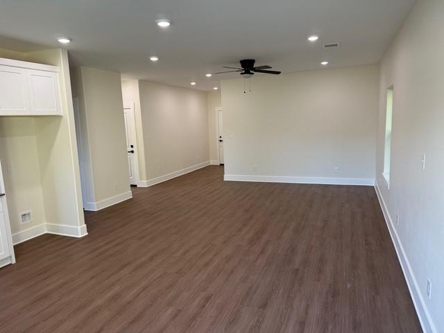 313 Garland Street Bells, TX 75414 - Photo 6 of 15 an empty room with wooden floor and windows