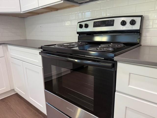 313 Garland Street Bells, TX 75414 - Photo 9 of 15 a stove top oven sitting inside of a kitchen