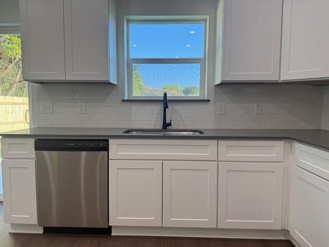 313 Garland Street Bells, TX 75414 - Photo 10 of 15 a kitchen with granite countertop white cabinets and a sink