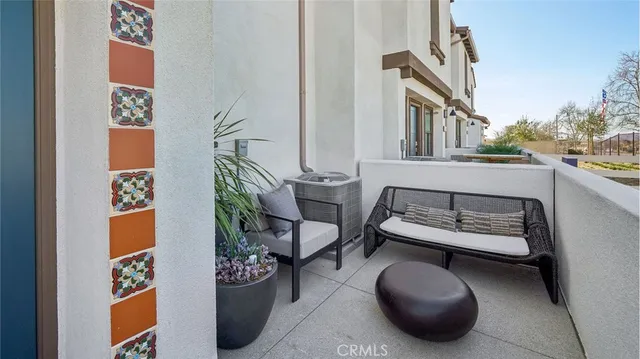 a living room with furniture and a chair
