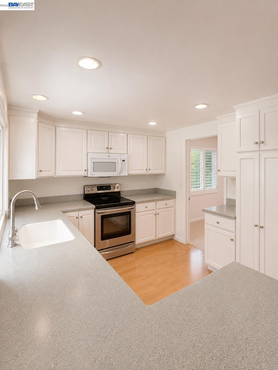 2516 Dos Rios Drive San Ramon, CA 94583 - Photo 7 of 14 a kitchen with stainless steel appliances granite countertop a sink and cabinets
