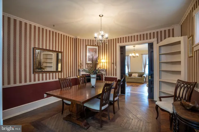 a view of a livingroom with furniture window and wooden floor