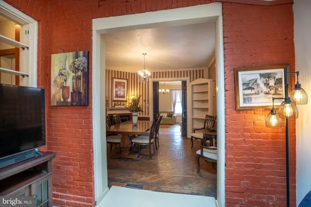 a kitchen with stainless steel appliances granite countertop white cabinets and stove top oven