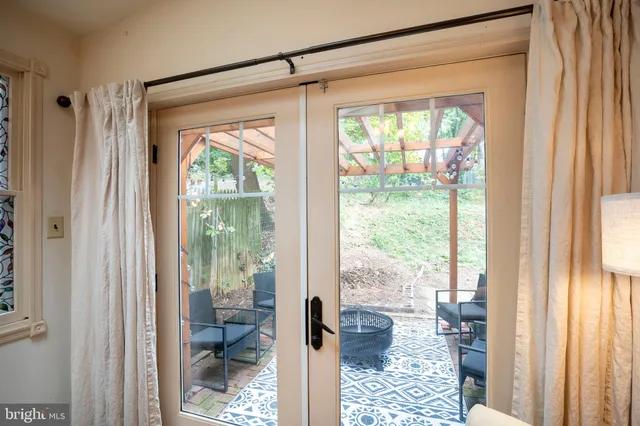 a view of a hallway with wooden floor and a hallway