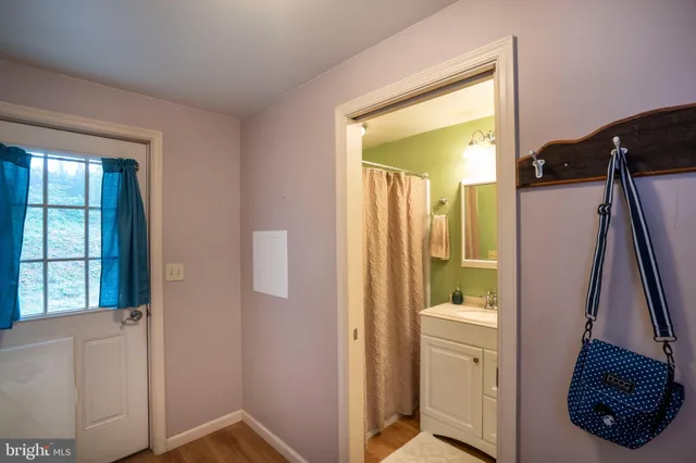 a view of an entryway with wooden floor and stairs