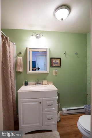 a living room with a fireplace a flat screen tv and a fireplace