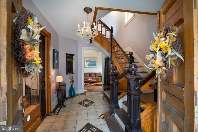 a kitchen with stainless steel appliances kitchen island granite countertop a stove a sink and a refrigerator