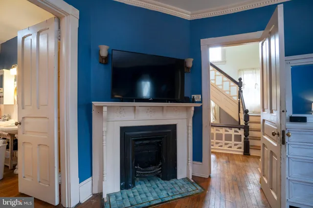 a bedroom with furniture and a flat screen tv