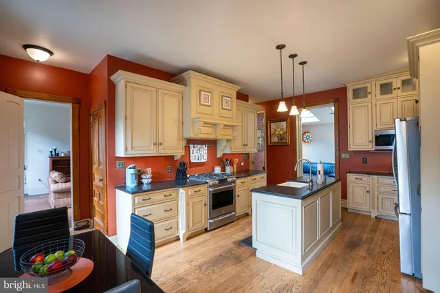 a bedroom with furniture and a chandelier