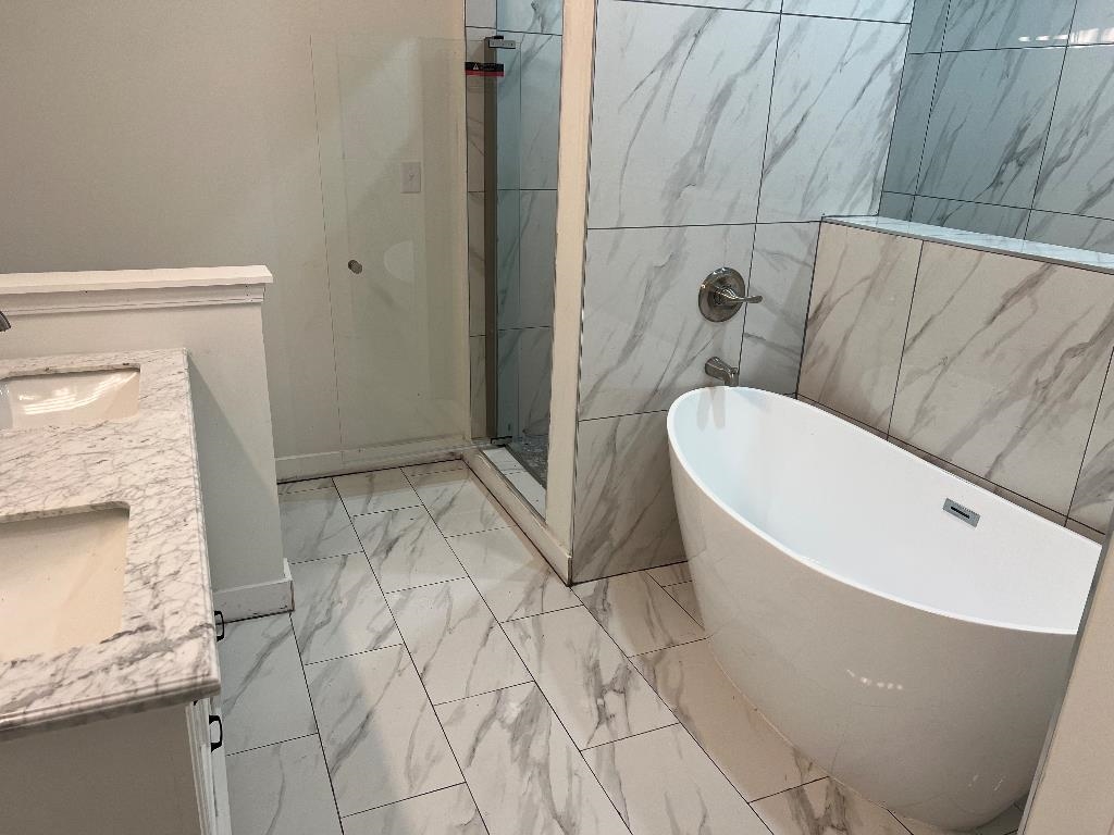 4566 Independent Road Bartlett, TN 38002 - Photo 10 of 24 a bathroom with a bathtub and shower