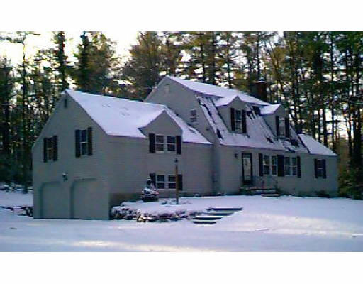 148 Spofford Road Boxford, MA 01921 - Photo 1 of 2 a house with trees in the background