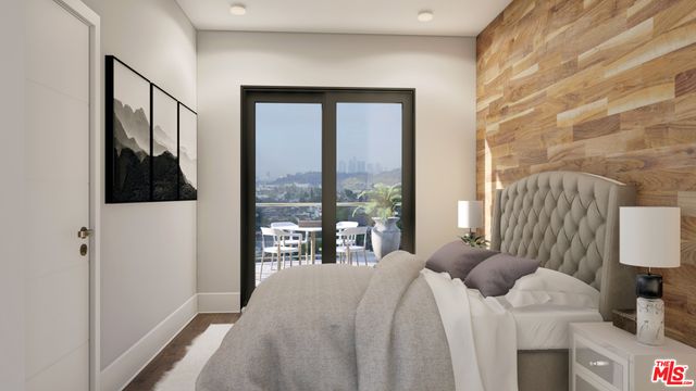 a bedroom with a bed and a lamp next to a window