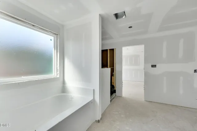 a bathroom with a bathtub and shower