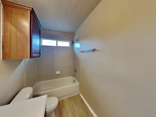 a bathroom with a bathtub and shower