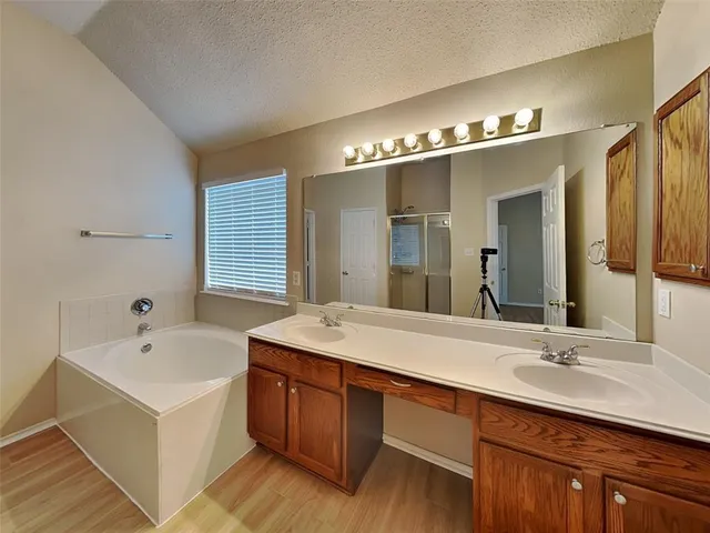 a bathroom with a sink double vanity and a mirror