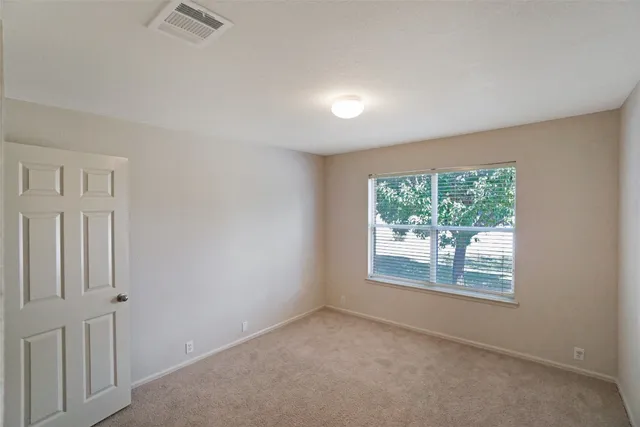 a white toilet sitting next to a white walls