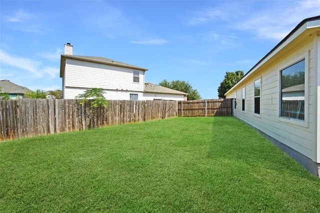 a front view of a house with yard