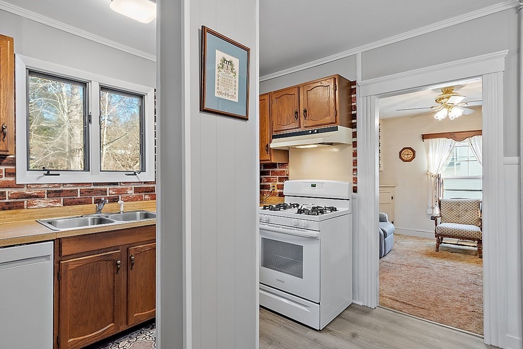 206 Beaconsfield Road Worcester, MA 01602 - Photo 18 of 39 a kitchen with a stove a sink and a refrigerator