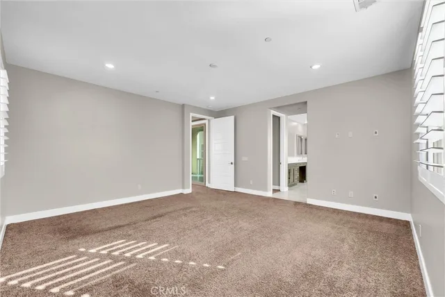 a spacious bathroom with a bathtub and a shower