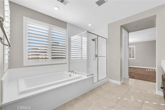a utility room with cabinets washer and dryer
