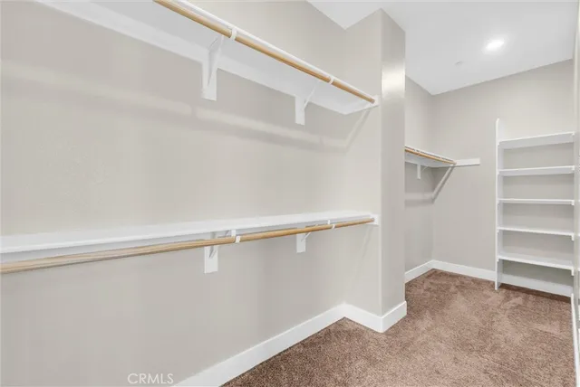 a view of an empty room and a fireplace