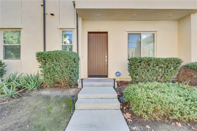 an empty room with windows and mirror
