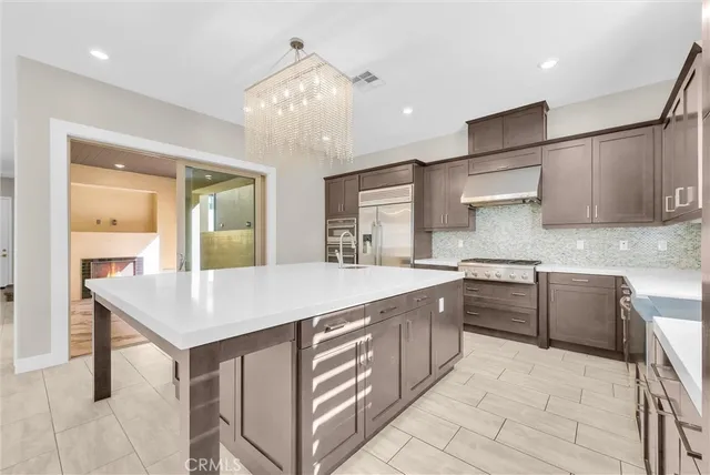 a kitchen with a stove and a sink