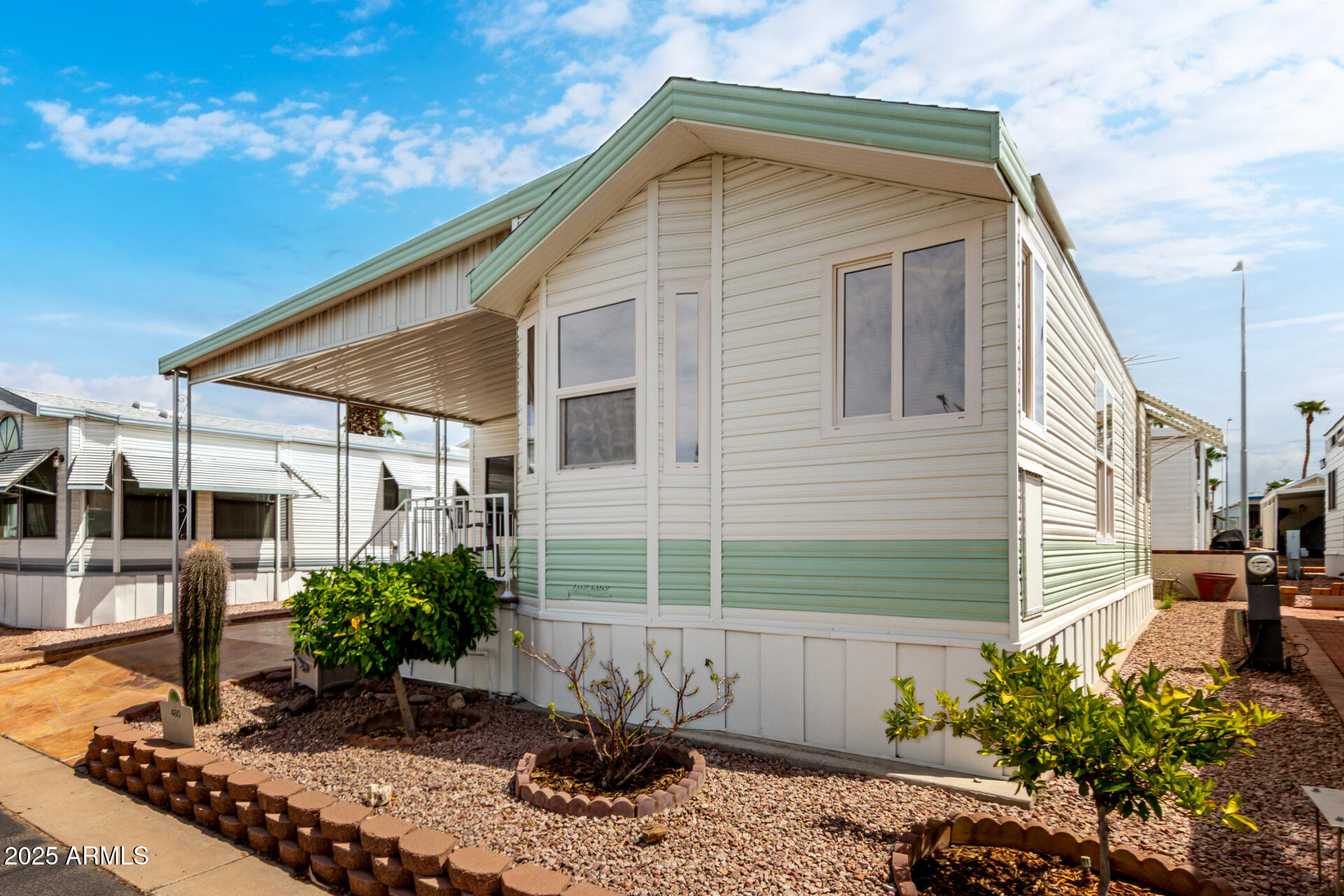 111 South Greenfield Road, Unit 480 Mesa, AZ 85206 - Photo 2 of 29 a view of a house with a yard