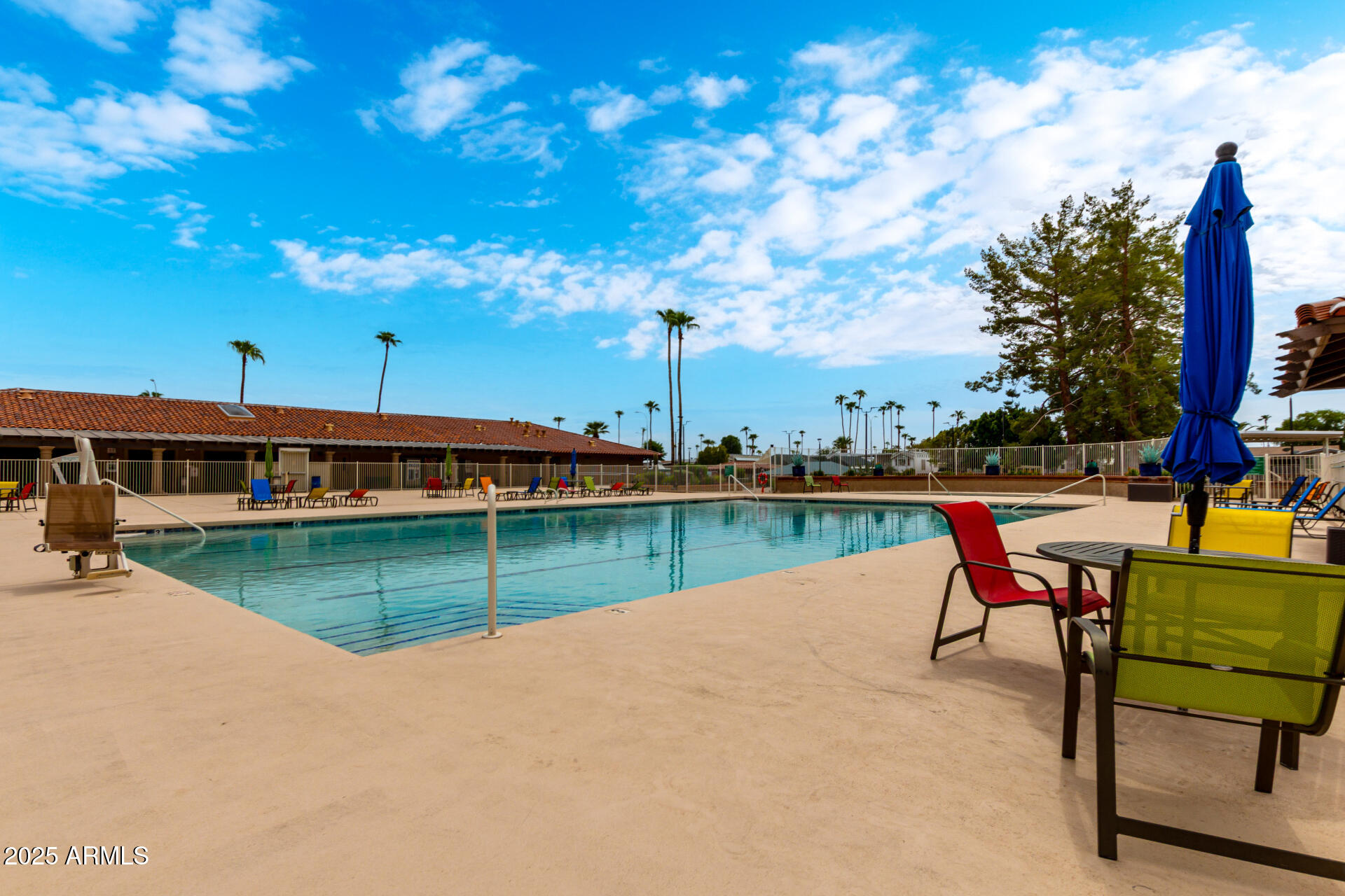 111 South Greenfield Road, Unit 480 Mesa, AZ 85206 - Photo 27 of 29 a view of a swimming pool with a lounge chairs