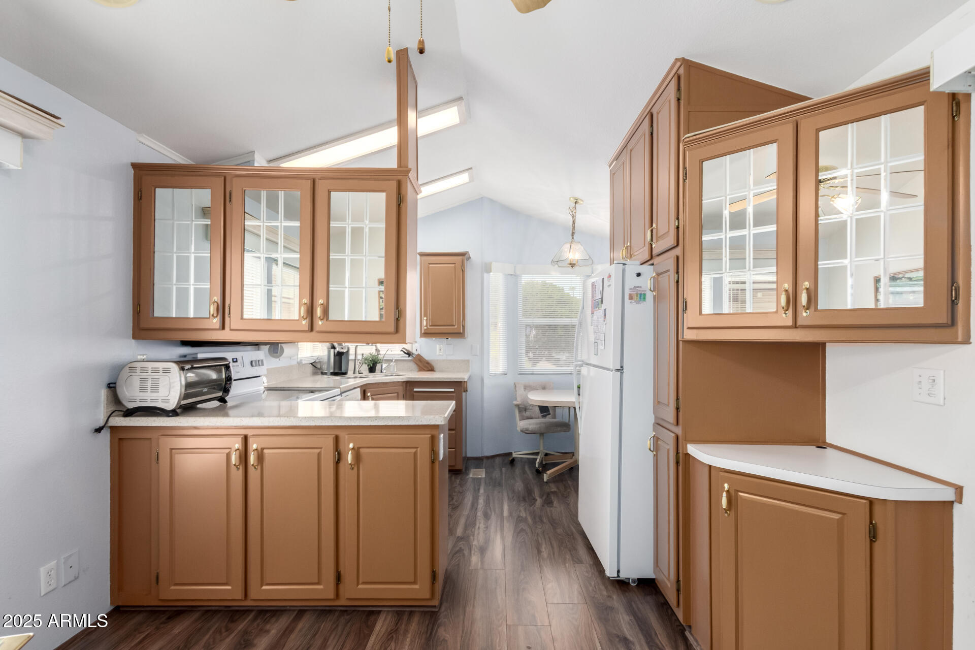 111 South Greenfield Road, Unit 480 Mesa, AZ 85206 - Photo 9 of 29 a kitchen with sink cabinets and wooden floor